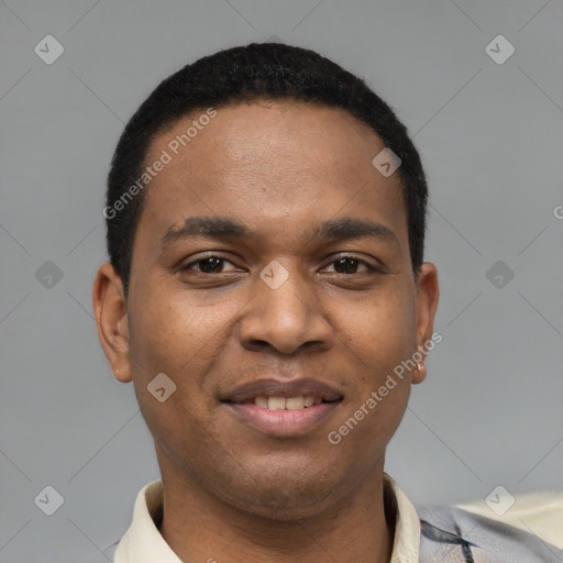 Joyful latino young-adult male with short  black hair and brown eyes