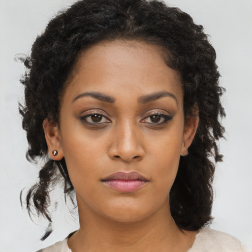 Neutral black young-adult female with medium  brown hair and brown eyes