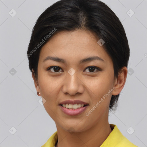 Joyful latino young-adult female with short  black hair and brown eyes