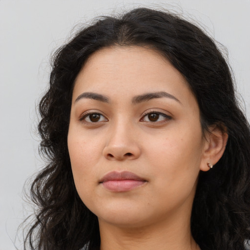 Neutral latino young-adult female with long  brown hair and brown eyes