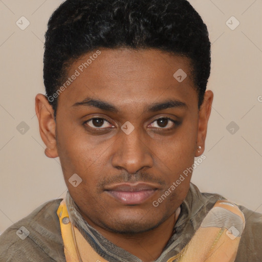 Joyful black young-adult male with short  brown hair and brown eyes