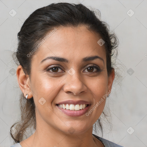 Joyful latino young-adult female with medium  brown hair and brown eyes