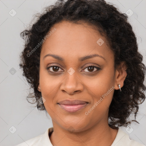 Joyful black adult female with medium  brown hair and brown eyes