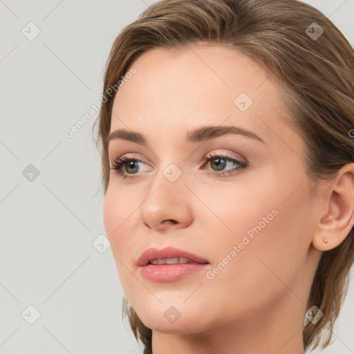 Joyful white young-adult female with medium  brown hair and blue eyes