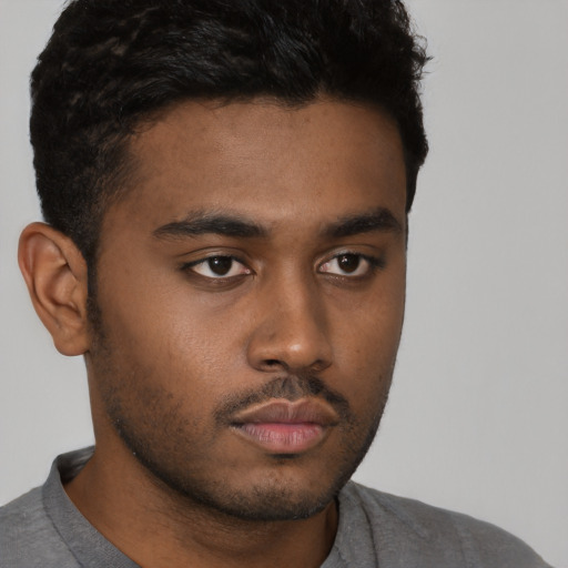 Neutral latino young-adult male with short  brown hair and brown eyes