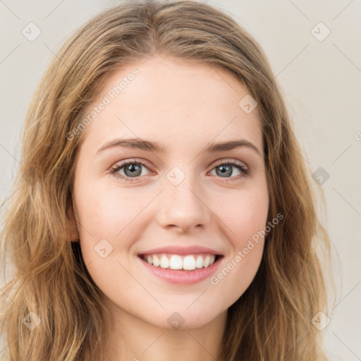 Joyful white young-adult female with long  brown hair and green eyes