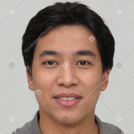 Joyful asian young-adult male with short  black hair and brown eyes