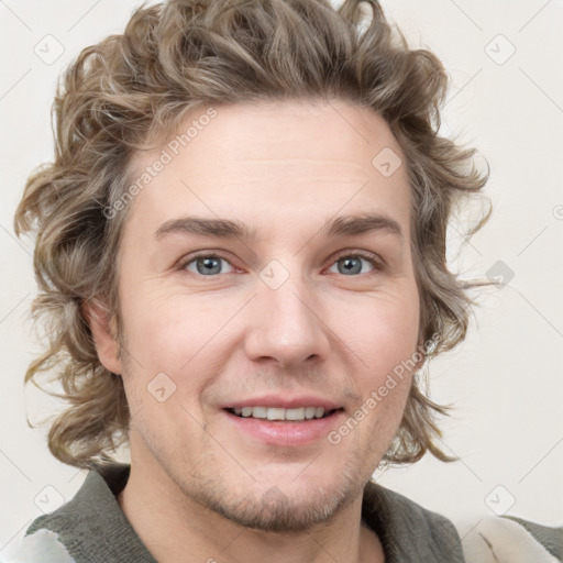 Joyful white adult male with short  brown hair and grey eyes