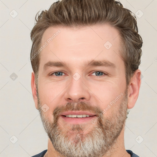 Joyful white adult male with short  brown hair and grey eyes