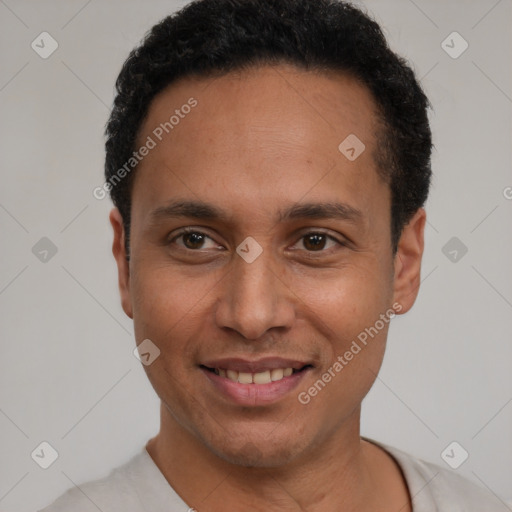 Joyful latino young-adult male with short  brown hair and brown eyes