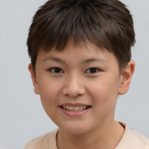Joyful white child male with short  brown hair and brown eyes