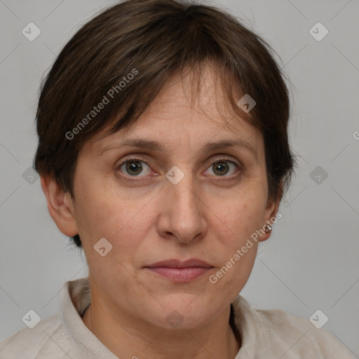 Joyful white adult female with medium  brown hair and grey eyes