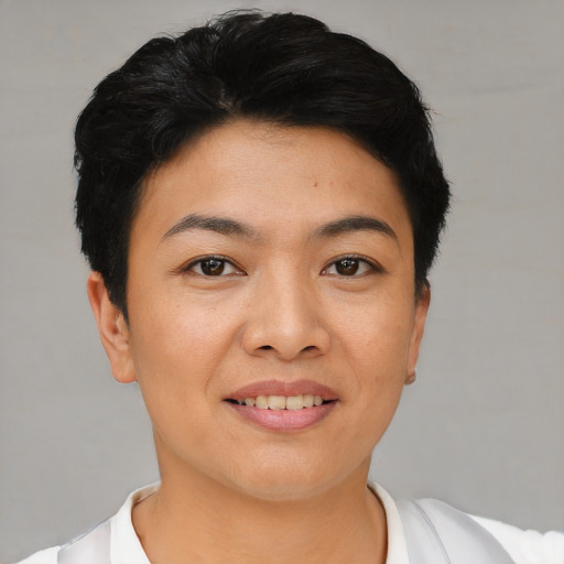 Joyful asian young-adult female with short  black hair and brown eyes