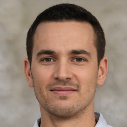 Joyful white young-adult male with short  brown hair and brown eyes