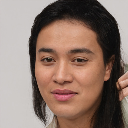 Joyful asian young-adult female with medium  brown hair and brown eyes