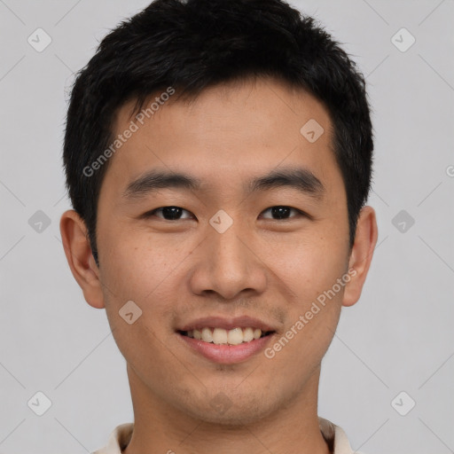 Joyful asian young-adult male with short  black hair and brown eyes