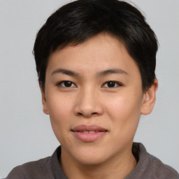 Joyful asian young-adult female with short  brown hair and brown eyes