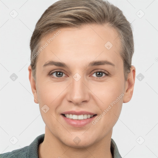 Joyful white young-adult female with short  brown hair and brown eyes