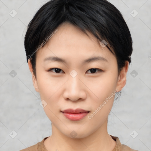 Joyful asian young-adult female with short  black hair and brown eyes