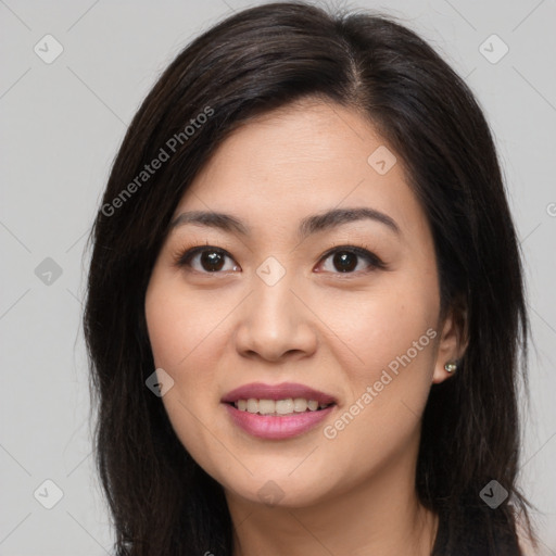 Joyful asian young-adult female with long  brown hair and brown eyes