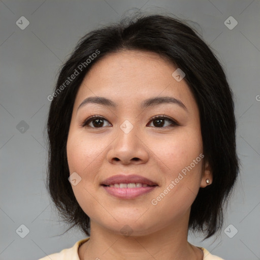 Joyful asian young-adult female with medium  brown hair and brown eyes