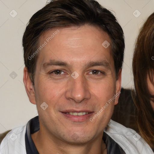 Joyful white adult male with short  brown hair and brown eyes