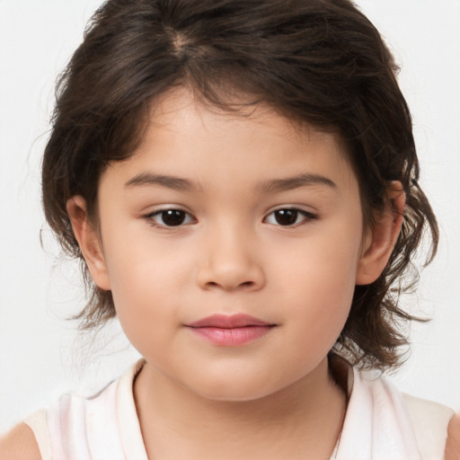 Joyful white child female with medium  brown hair and brown eyes