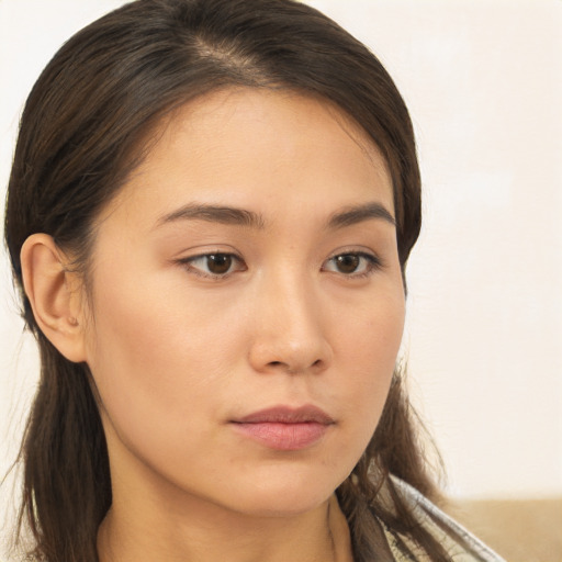 Neutral white young-adult female with long  brown hair and brown eyes