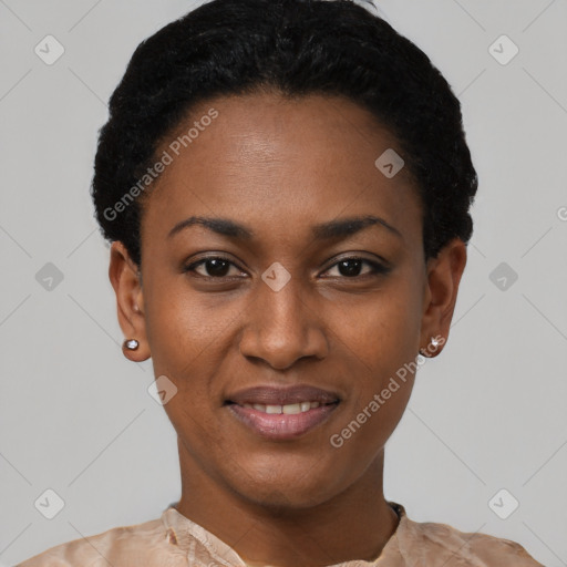 Joyful black young-adult female with short  black hair and brown eyes