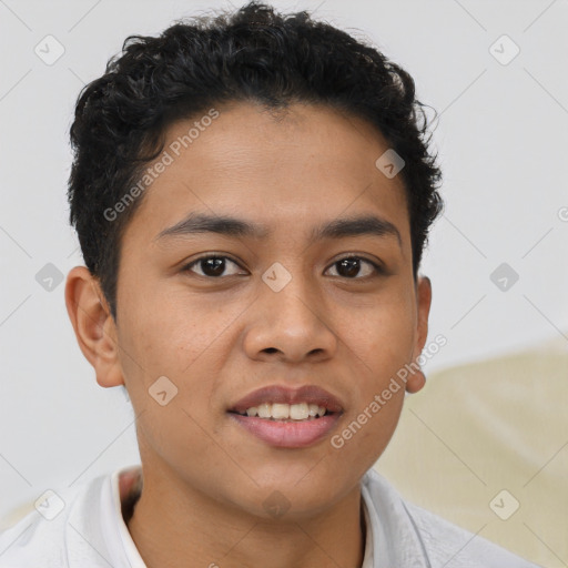 Joyful latino young-adult male with short  brown hair and brown eyes