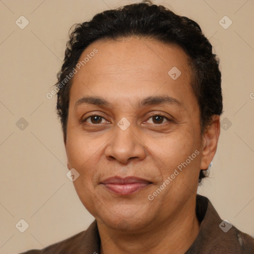 Joyful latino adult female with short  brown hair and brown eyes