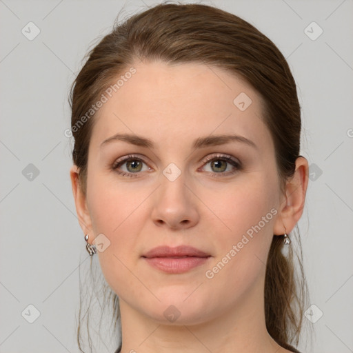 Joyful white young-adult female with medium  brown hair and grey eyes