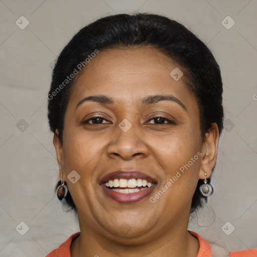 Joyful latino adult female with short  brown hair and brown eyes