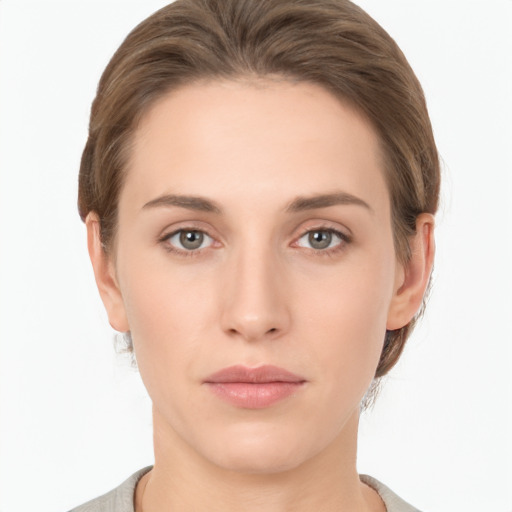 Neutral white young-adult female with short  brown hair and brown eyes