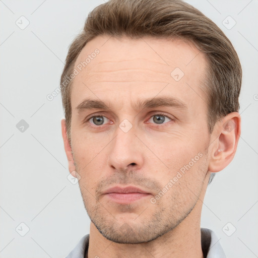 Neutral white young-adult male with short  brown hair and grey eyes