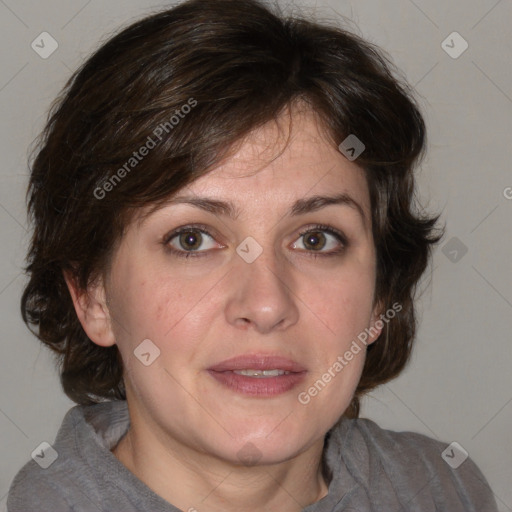 Joyful white adult female with medium  brown hair and blue eyes