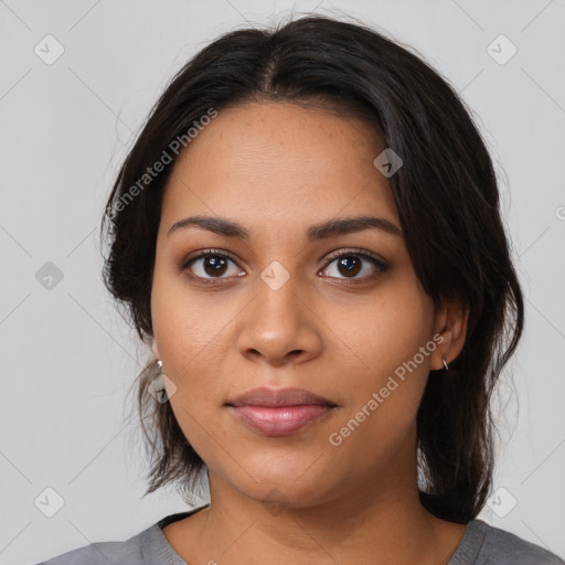 Joyful latino young-adult female with medium  black hair and brown eyes