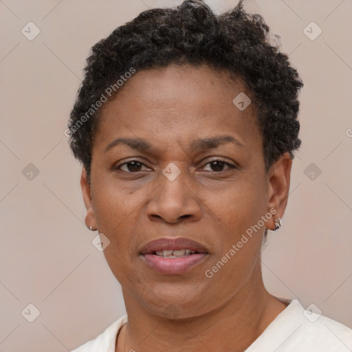 Joyful black adult female with short  brown hair and brown eyes