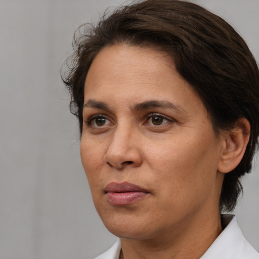 Neutral white adult female with medium  brown hair and brown eyes