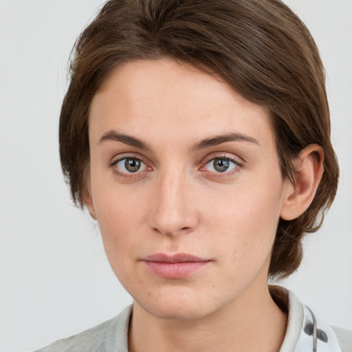 Neutral white young-adult female with medium  brown hair and grey eyes