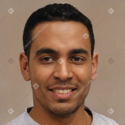 Joyful latino young-adult male with short  black hair and brown eyes