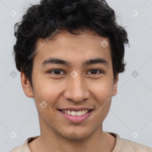 Joyful latino young-adult male with short  brown hair and brown eyes