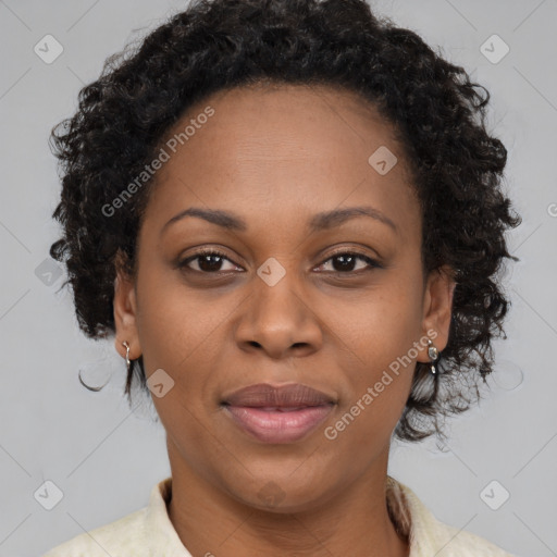 Joyful black adult female with short  brown hair and brown eyes