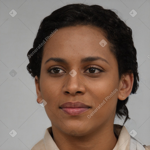 Joyful black young-adult female with short  brown hair and brown eyes