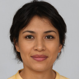 Joyful asian young-adult female with short  brown hair and brown eyes