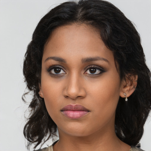 Neutral latino young-adult female with long  brown hair and brown eyes