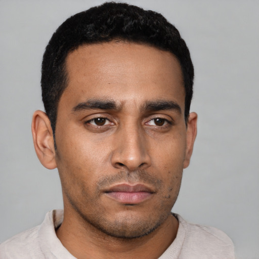 Neutral latino young-adult male with short  black hair and brown eyes