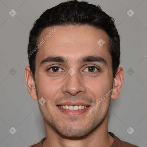 Joyful white young-adult male with short  black hair and brown eyes