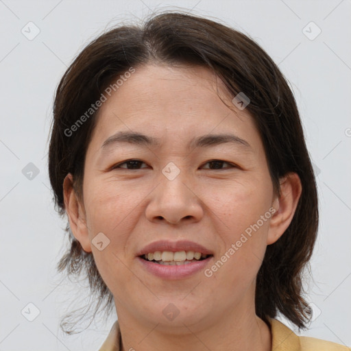 Joyful white adult female with medium  brown hair and brown eyes