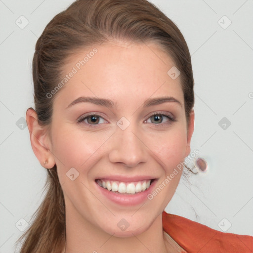 Joyful white young-adult female with long  brown hair and blue eyes